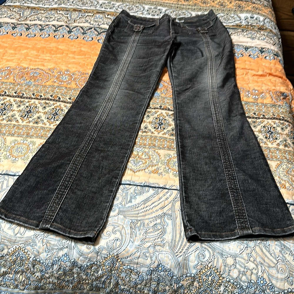 Size 11 gray corduroys with with unique stitching and pocket flaps, gently used